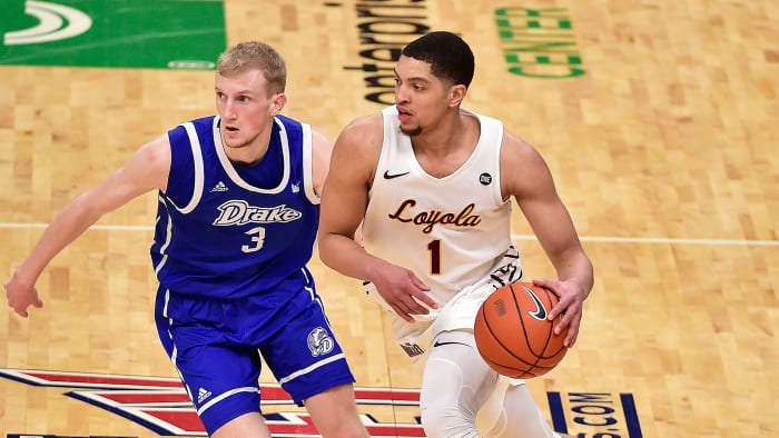 Loyola Chicago's Lucas Williamson dribbles against Drake